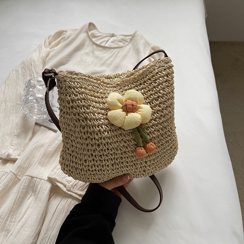 Hand-woven straw bucket bag