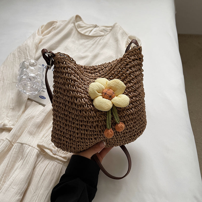 Hand-woven straw bucket bag