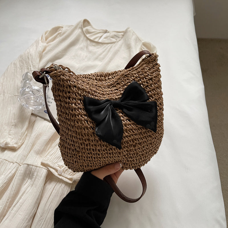 Hand-woven straw bucket bag